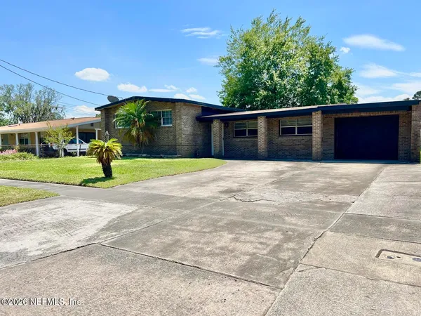 a house with trees in the background