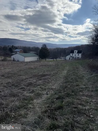 a view of a yard with an ocean