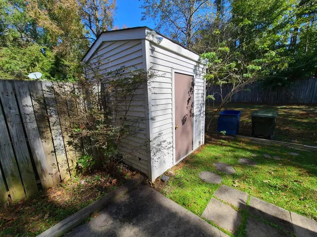 a backyard of a house with lots of green space