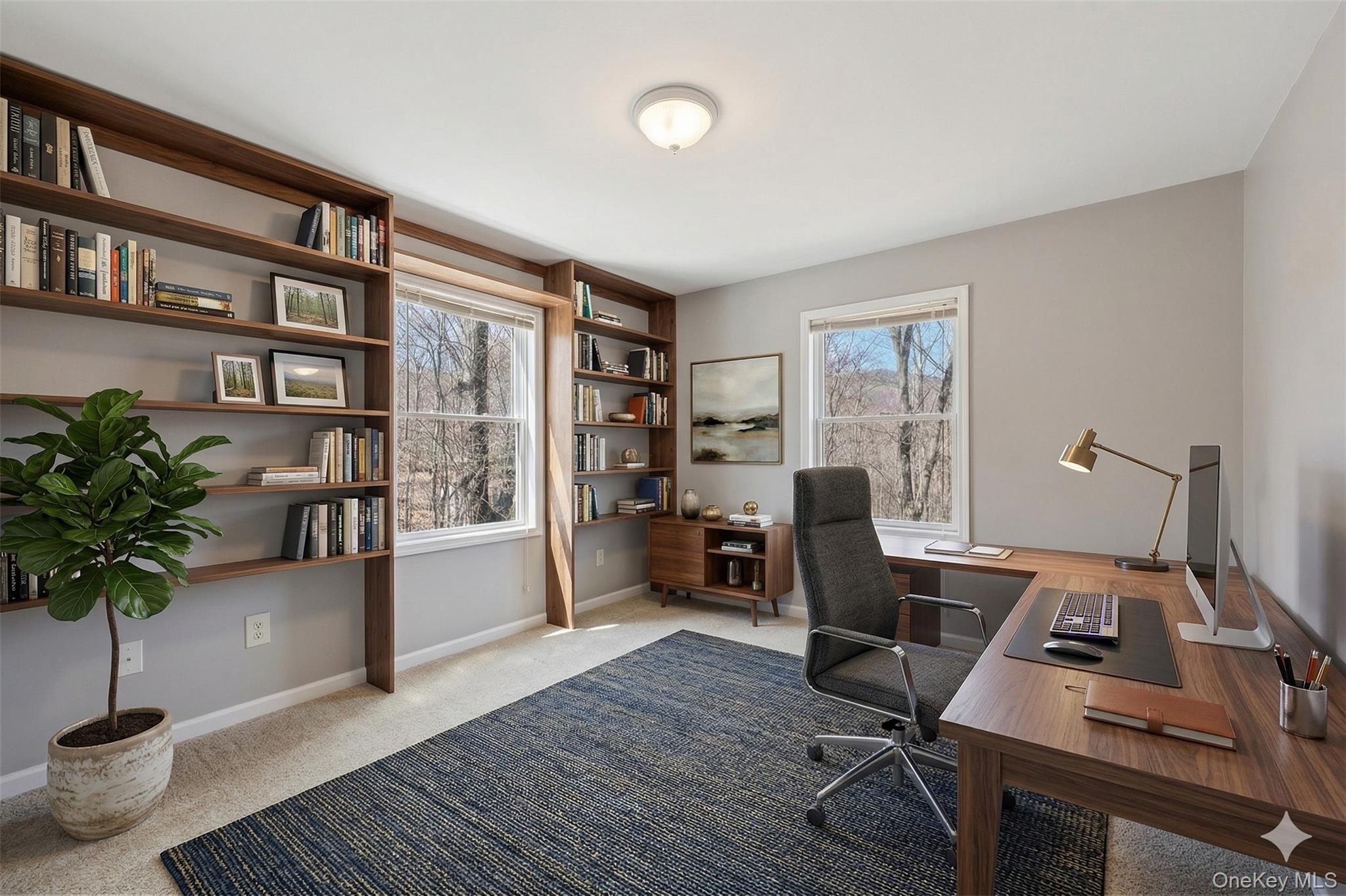 27 Krieger Road Fort Montgomery, NY 10922 - Photo 12 of 24 a view of a workspace with furniture and a potted plant