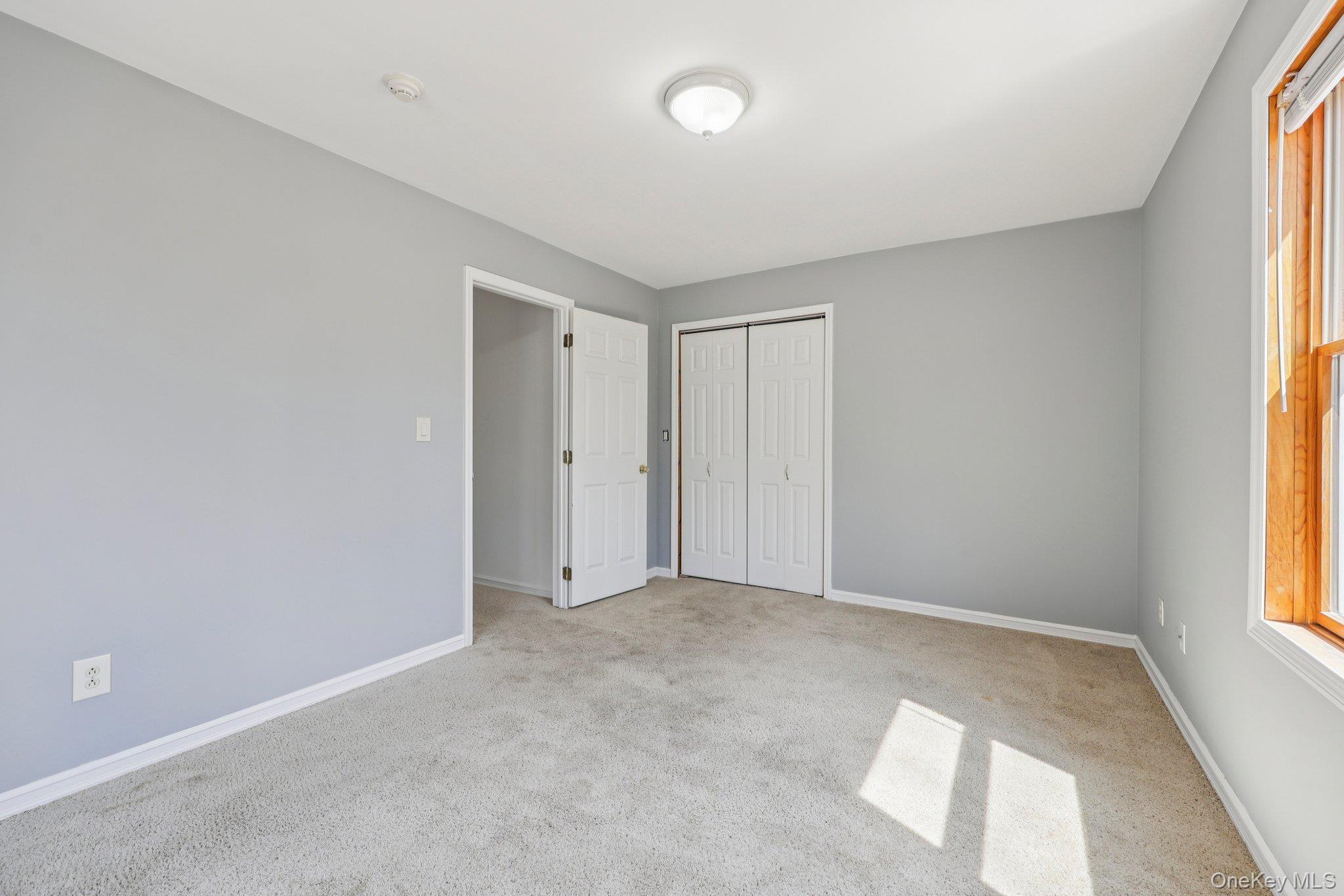 27 Krieger Road Fort Montgomery, NY 10922 - Photo 14 of 24 an empty room with windows