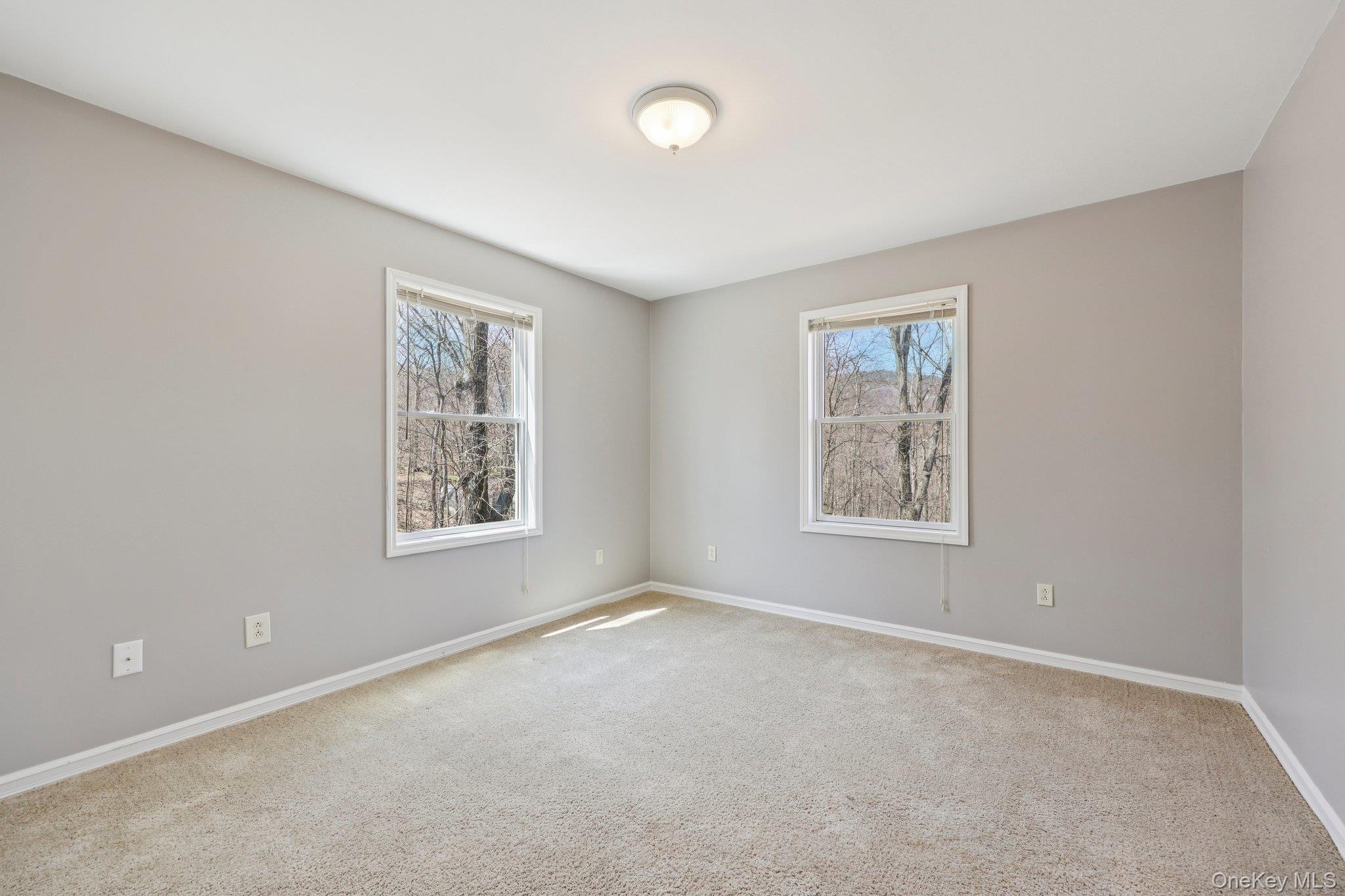 27 Krieger Road Fort Montgomery, NY 10922 - Photo 15 of 24 an empty room with windows