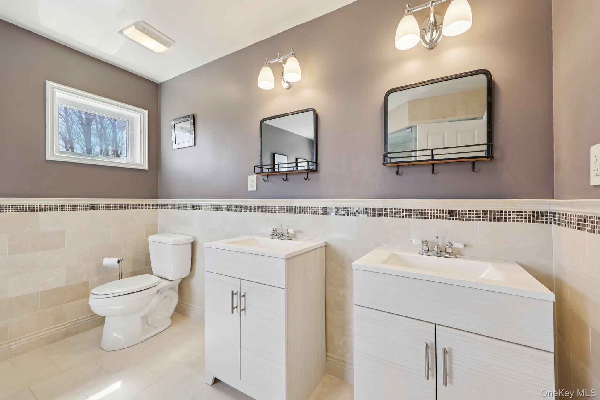 27 Krieger Road Fort Montgomery, NY 10922 - Photo 17 of 24 a bathroom with a toilet a sink and a mirror