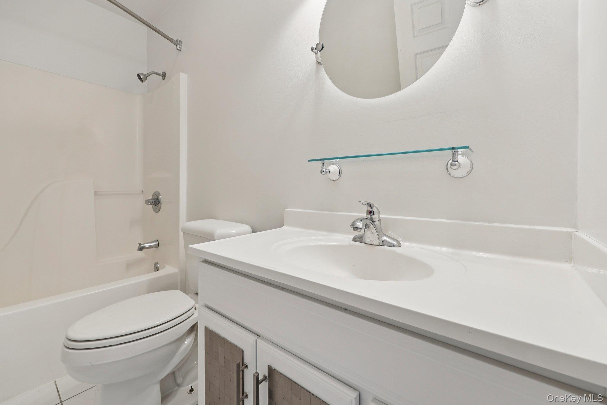 27 Krieger Road Fort Montgomery, NY 10922 - Photo 19 of 24 a bathroom with a sink a toilet and shower