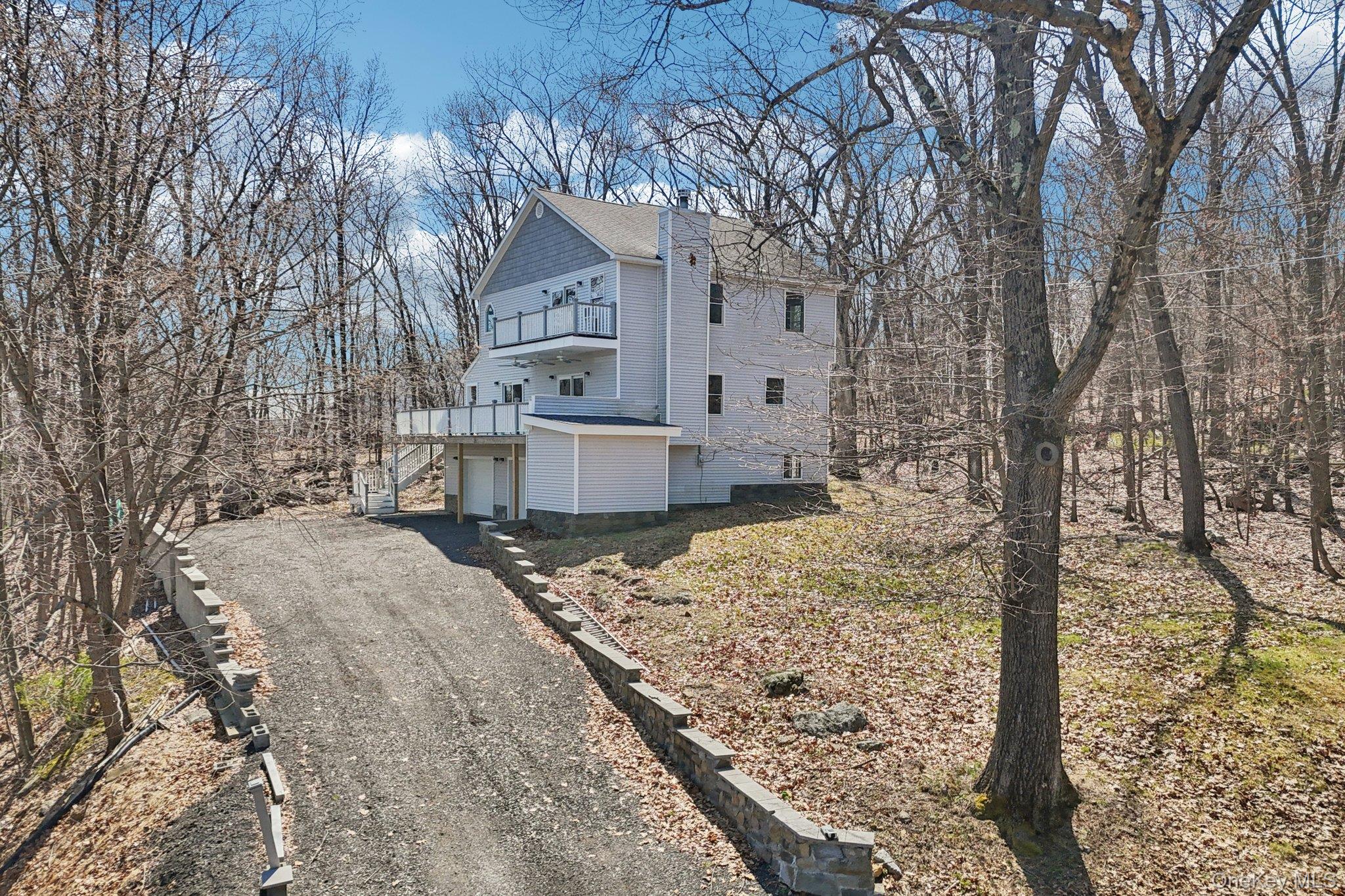 27 Krieger Road Fort Montgomery, NY 10922 - Photo 20 of 24 a large tree in front of a brick house