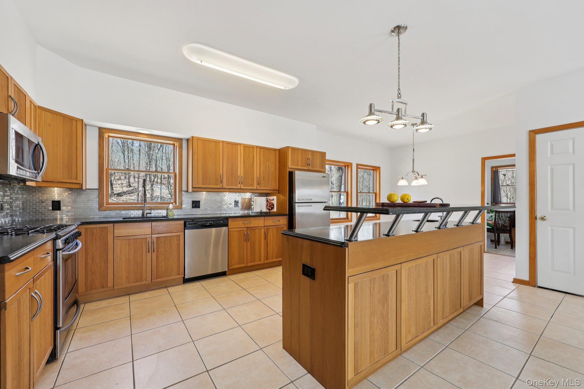 27 Krieger Road Fort Montgomery, NY 10922 - Photo 2 of 24 a kitchen with stainless steel appliances granite countertop a refrigerator and a stove top oven