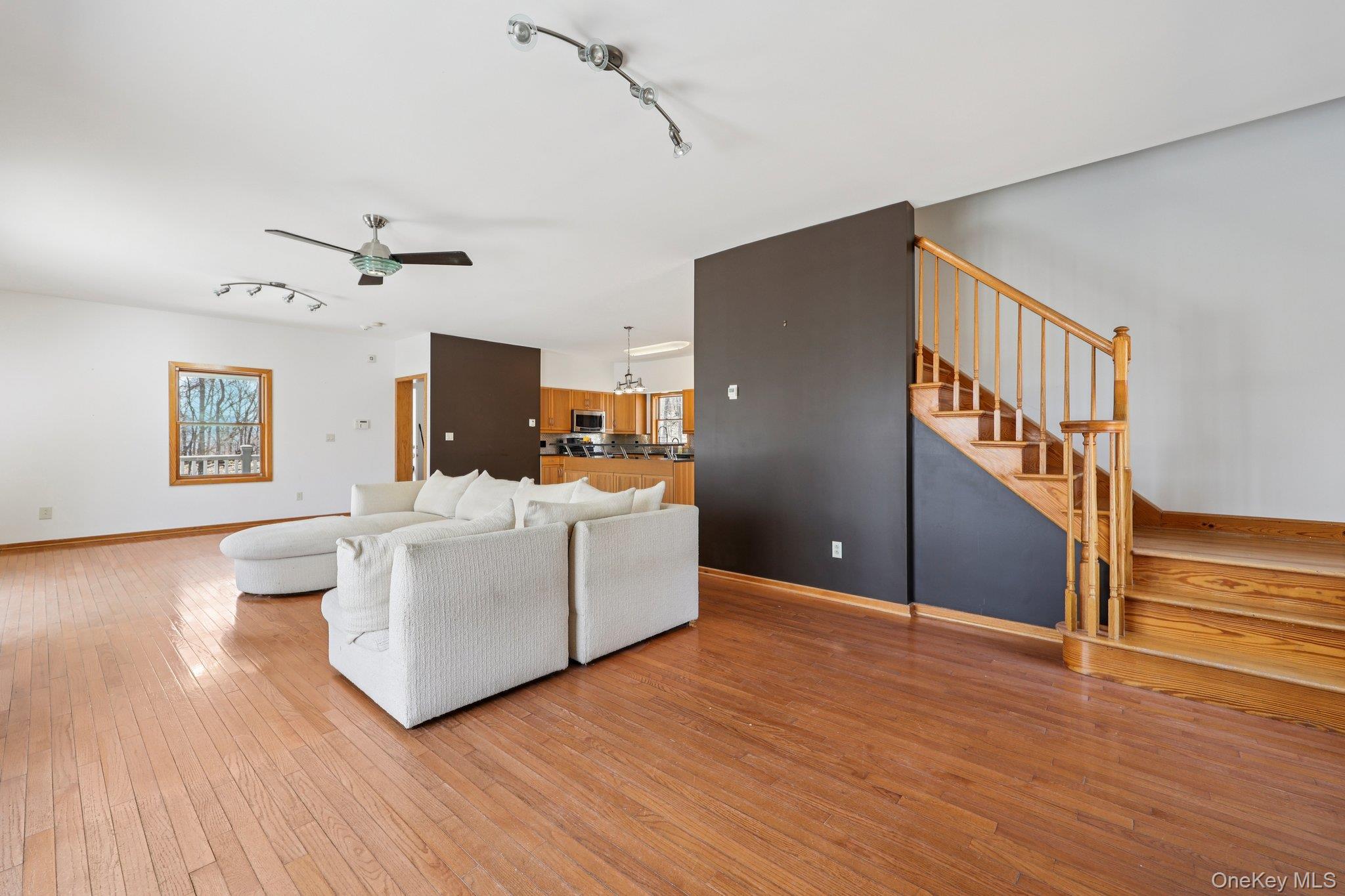 27 Krieger Road Fort Montgomery, NY 10922 - Photo 8 of 24 a living room with furniture and a wooden floor