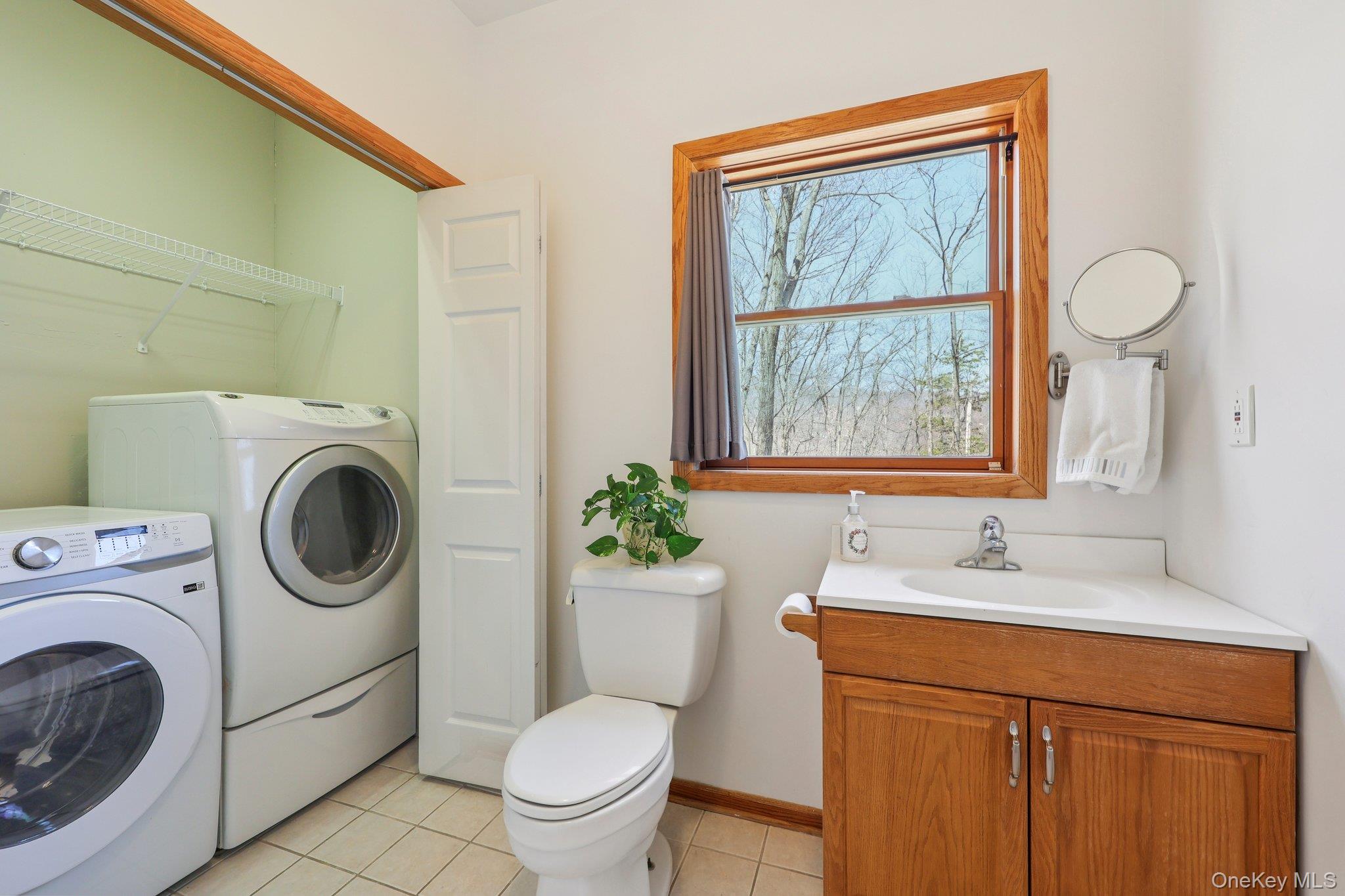 27 Krieger Road Fort Montgomery, NY 10922 - Photo 10 of 24 a bathroom with a granite countertop toilet sink and mirror