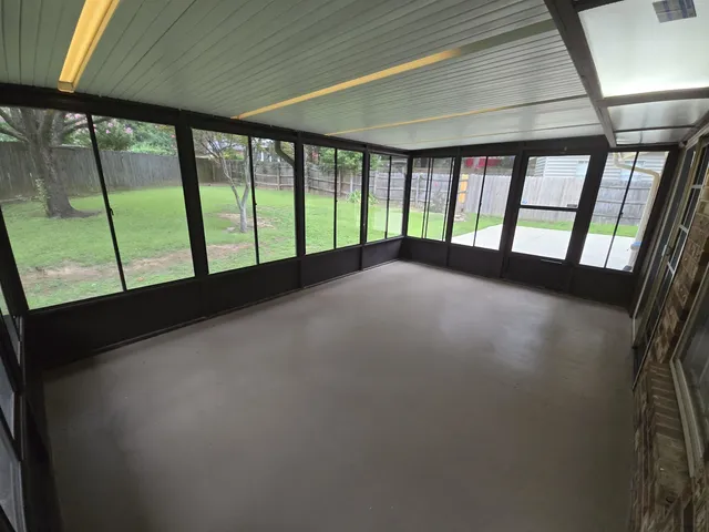 a view of an empty room with a window