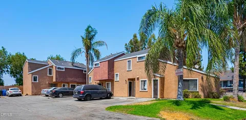 a car parked in front of white house