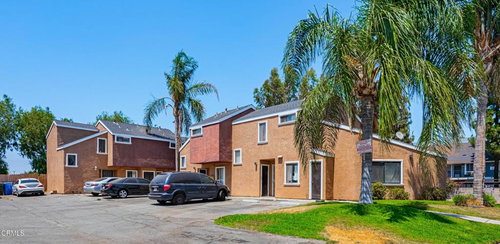 9039 Colony Place Riverside, CA 92503 - Photo 2 of 15 a car parked in front of white house