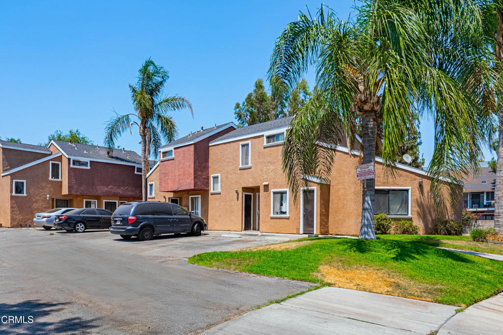 9039 Colony Place Riverside, CA 92503 - Photo 3 of 15 a car parked in front of white house