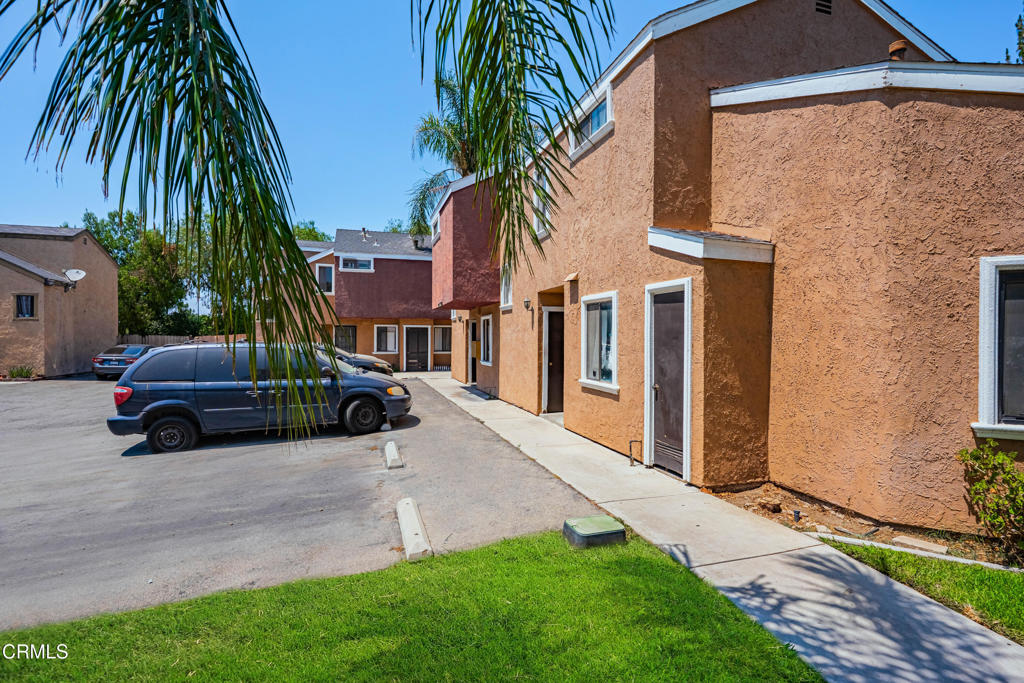 9039 Colony Place Riverside, CA 92503 - Photo 5 of 15 a view of a car parked in front of a house with a yard
