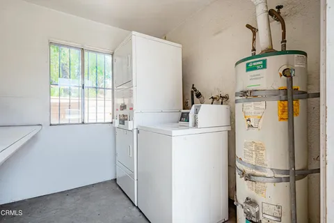 a room with refrigerator and window