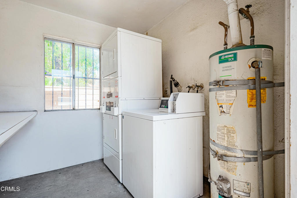 9039 Colony Place Riverside, CA 92503 - Photo 9 of 15 a room with refrigerator and window