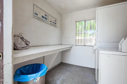 a kitchen with a refrigerator and a sink