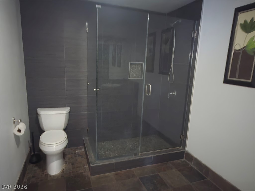 3381 Westwind Road Las Vegas, NV 89146 - Photo 33 of 52 A well-appointed bathroom features a spacious glass-enclosed shower and modern fixtures.