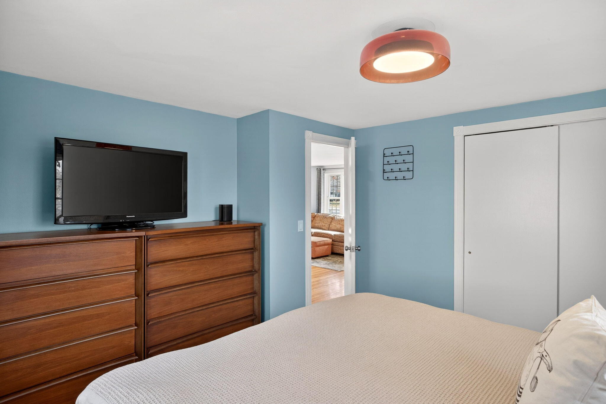 3 Januit Street Sandwich, MA 02563 - Photo 14 of 32 a bedroom with a bed and a flat screen tv