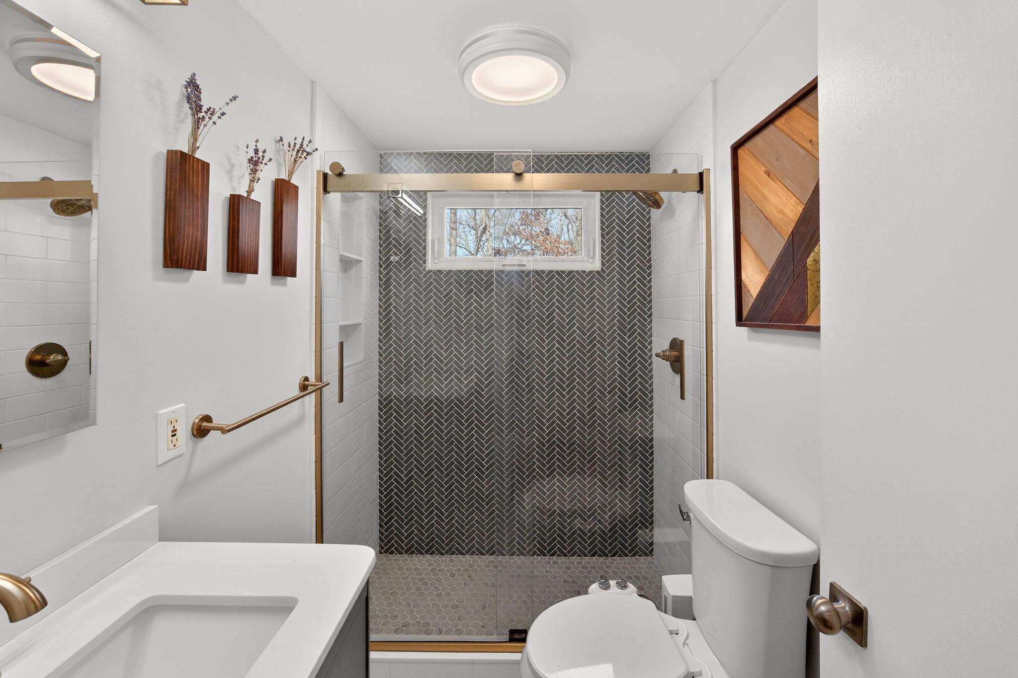 3 Januit Street Sandwich, MA 02563 - Photo 17 of 32 a bathroom with a sink toilet and shower
