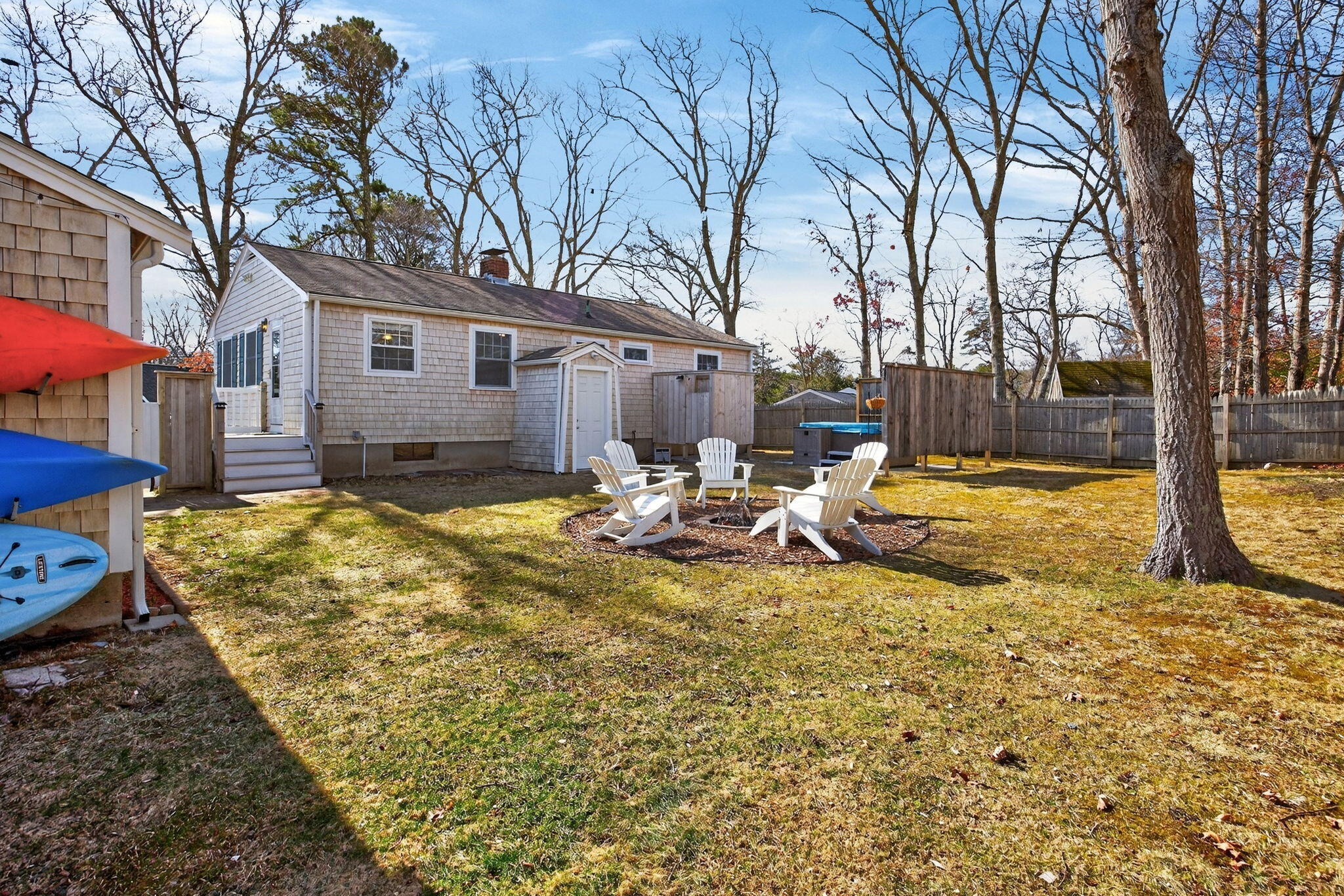 3 Januit Street Sandwich, MA 02563 - Photo 26 of 32 a view of a backyard with a large tree