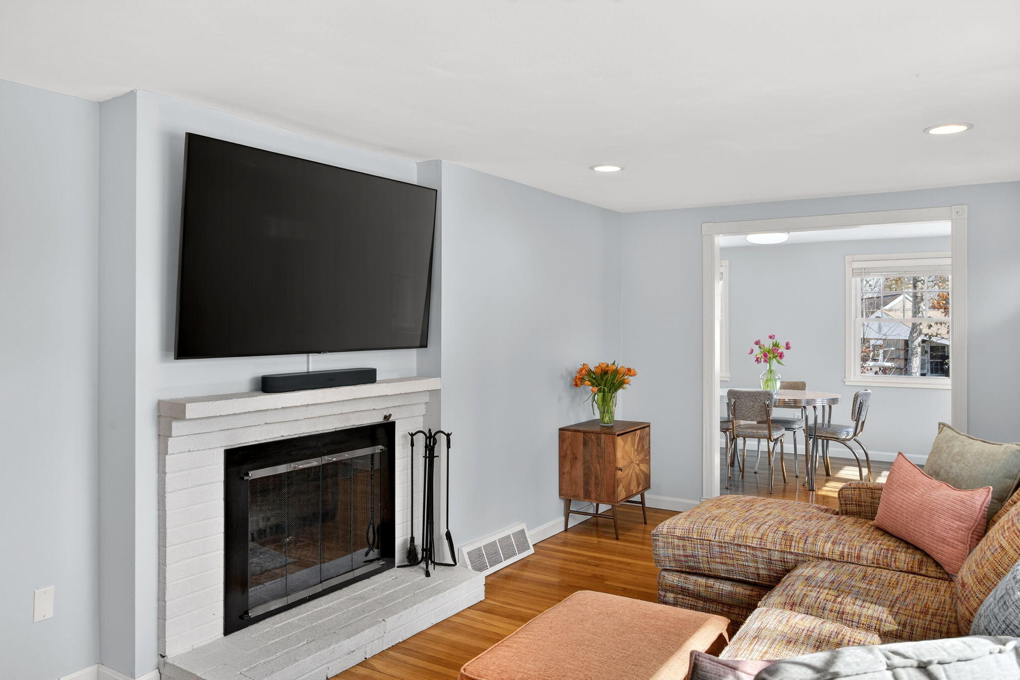 3 Januit Street Sandwich, MA 02563 - Photo 6 of 32 a living room with furniture a flat screen tv and a fireplace