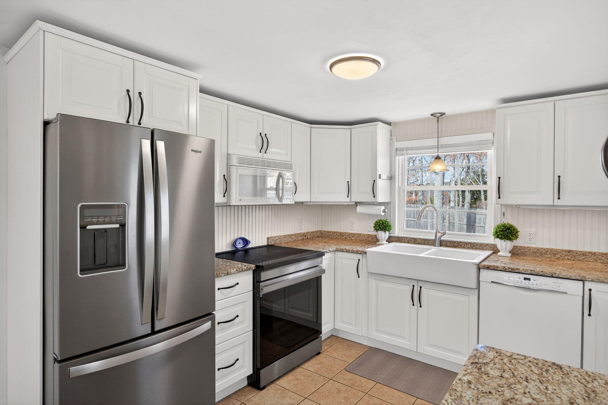 3 Januit Street Sandwich, MA 02563 - Photo 8 of 32 a kitchen with a sink stove and refrigerator
