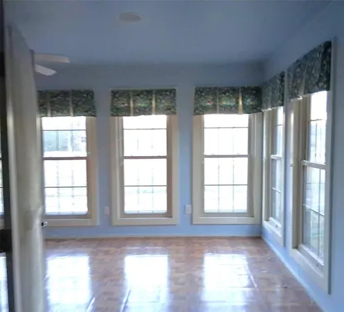 a view of an empty room and window