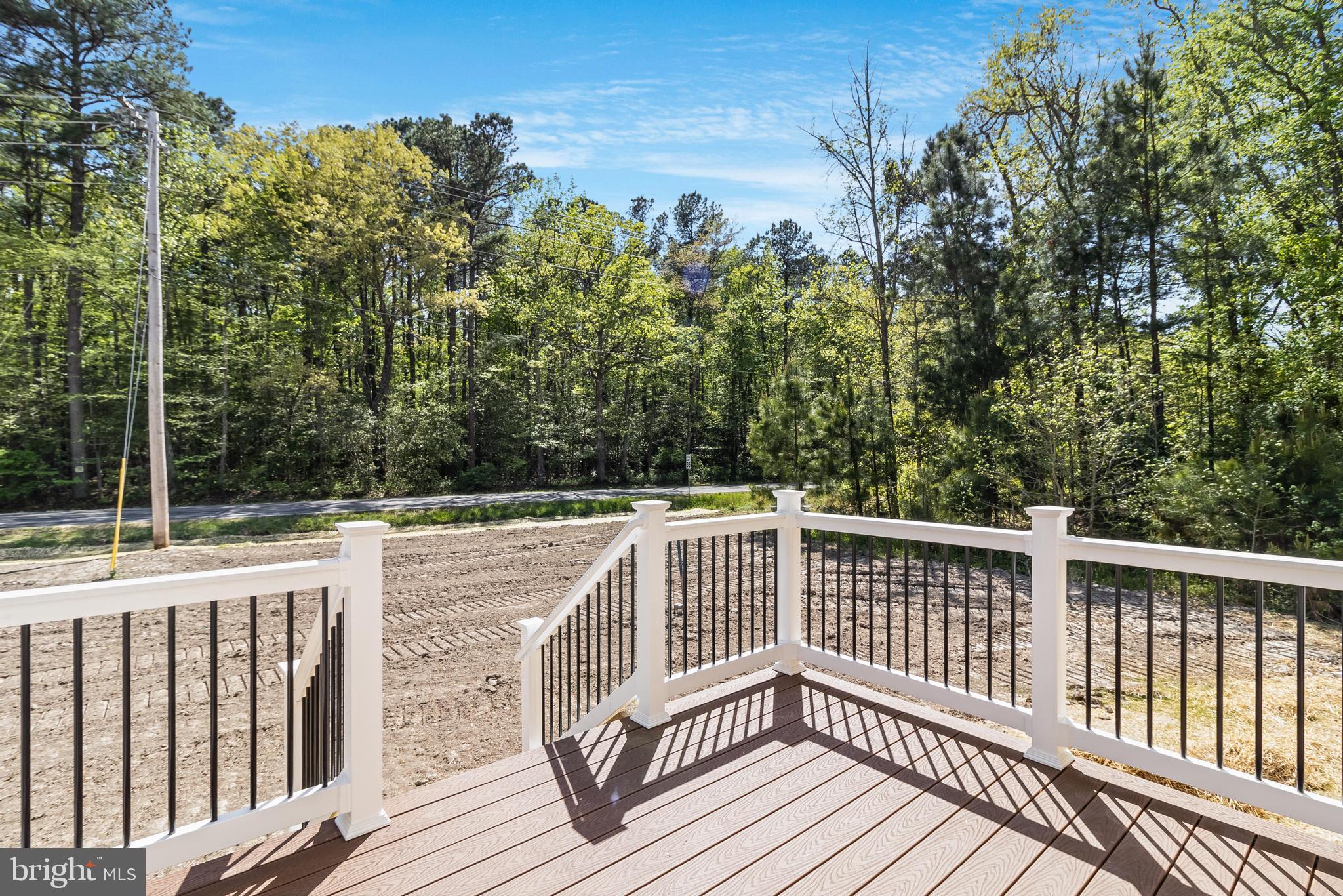 21183 Abell Road Avenue, MD 20609 - Photo 18 of 36 a view of balcony with wooden floor and fence