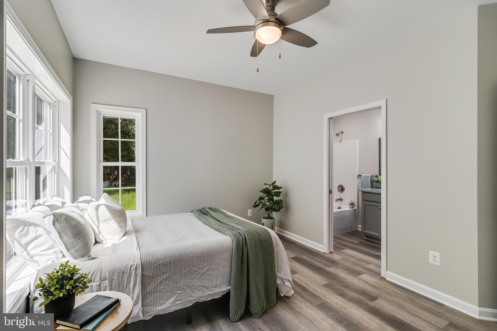 21183 Abell Road Avenue, MD 20609 - Photo 21 of 36 a bedroom with a bed and a window