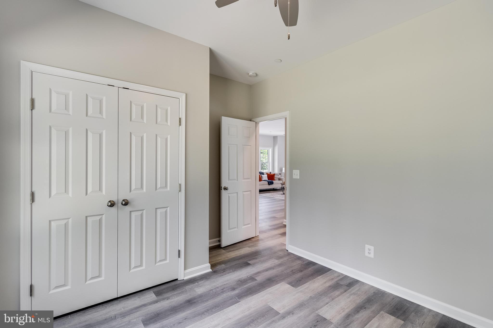 21183 Abell Road Avenue, MD 20609 - Photo 31 of 36 a view of an empty room with wooden floor