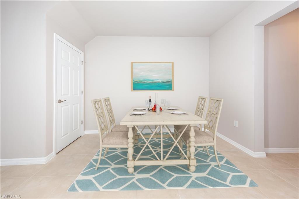 15319 Wildflower Circle Naples, FL 34119 - Photo 4 of 19 a view of a dining room with furniture