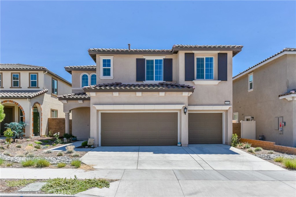 24198 Flora Road Corona, CA 92883 - Photo 1 of 1 a front view of a house with yard