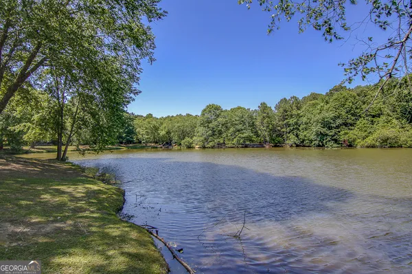 a view of a wooden bridge and lake view