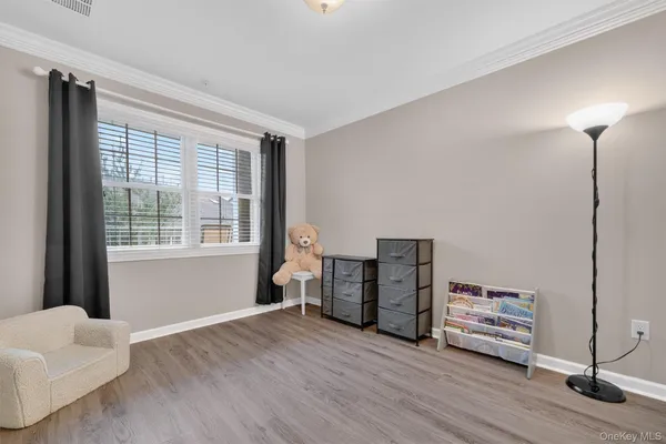 a view of a livingroom with furniture and a window