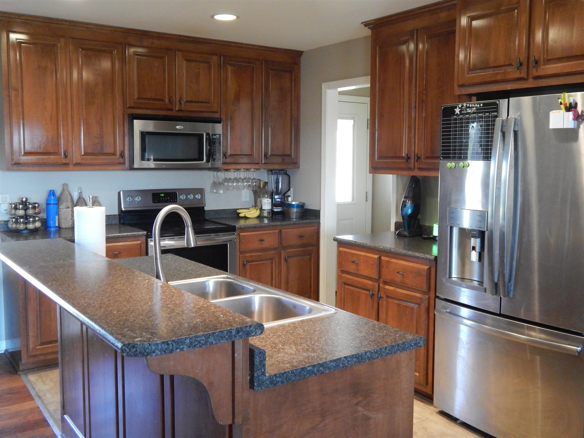 923 Baugh Road Ardmore, TN 38449 - Photo 3 of 16 This home is made for a cook! The stainless appliances and the middle island is great for convenience all around.