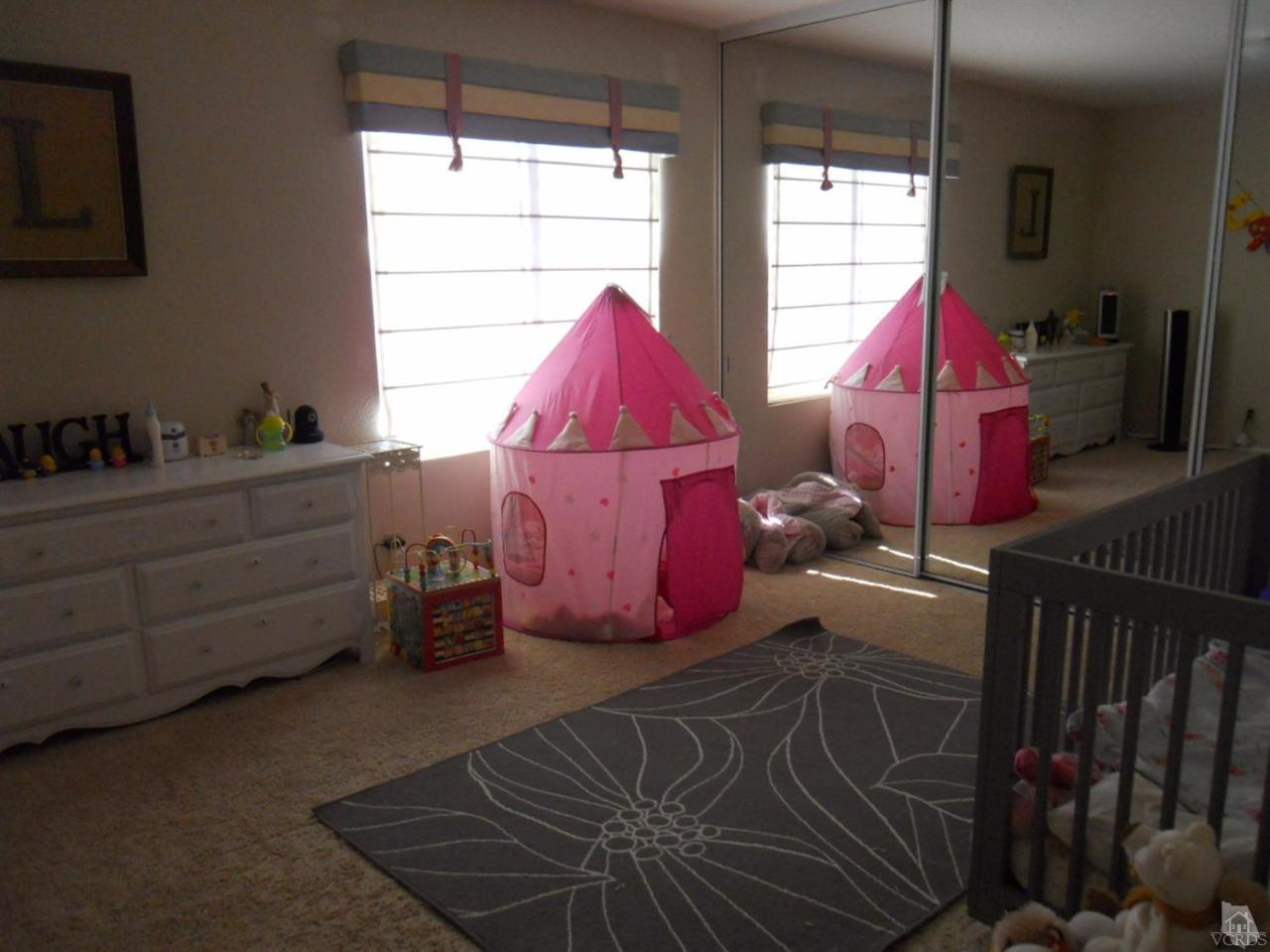 4062 Doneva Road Moorpark, CA 93021 - Photo 14 of 26 a bed room with a bed and a window