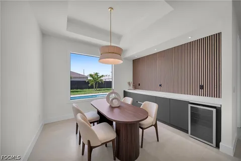 a large white kitchen with a large window