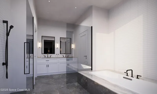 a bathroom with a tub sink and mirror