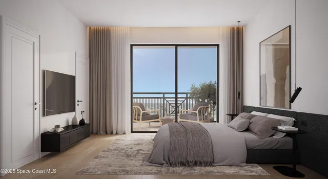 a bedroom with a large bed and a flat tv screen