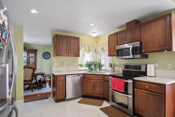 a kitchen with a sink stove and cabinets