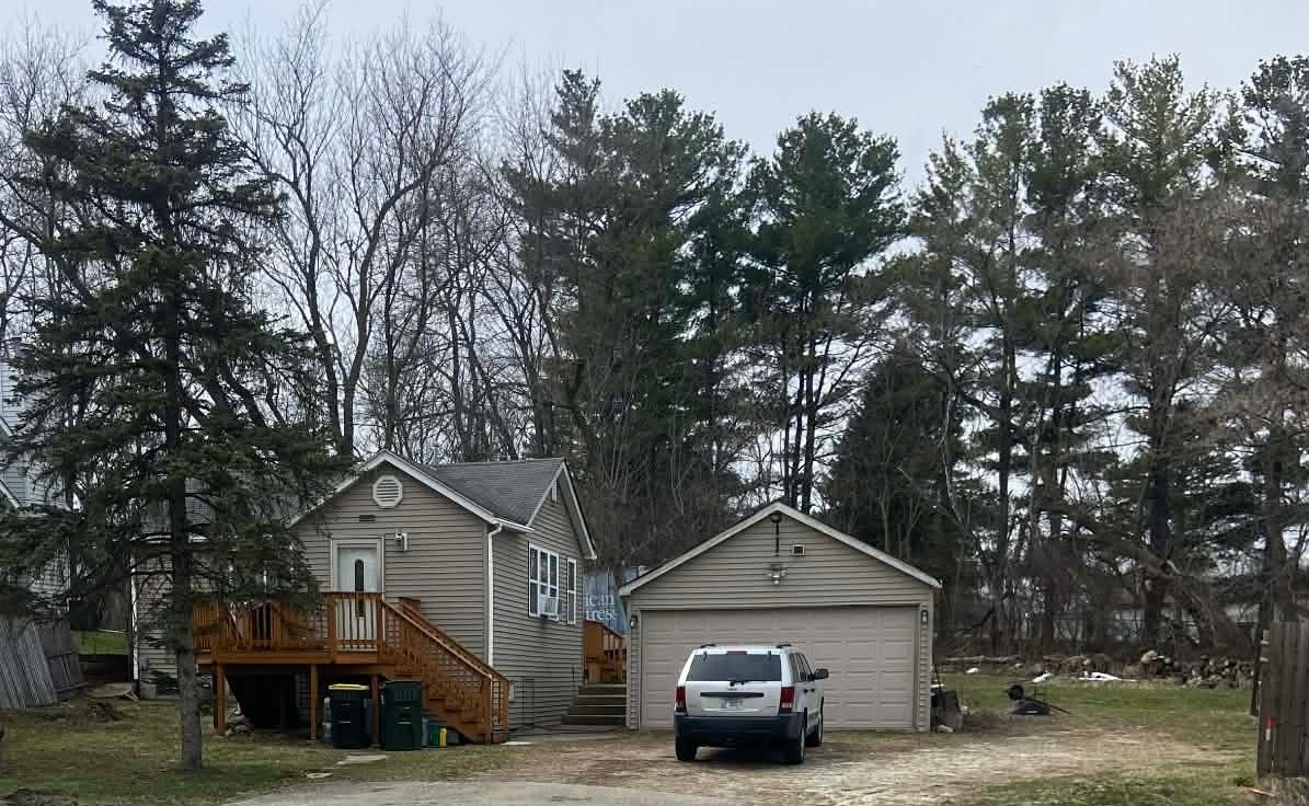 31750 North Darrell Road Lakemoor, IL 60051 - Photo 1 of 1 a front view of a house with parking space and trees