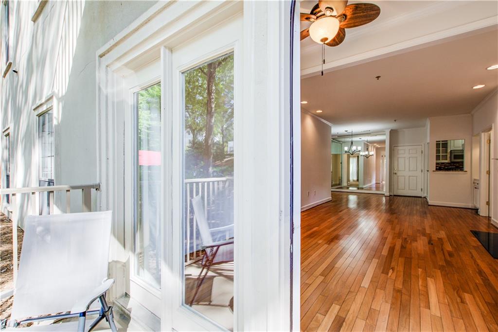 2865 Lenox Road Northeast, Unit 102 Atlanta, GA 30324 - Photo 16 of 35 a view of a hallway view with wooden floor and windows
