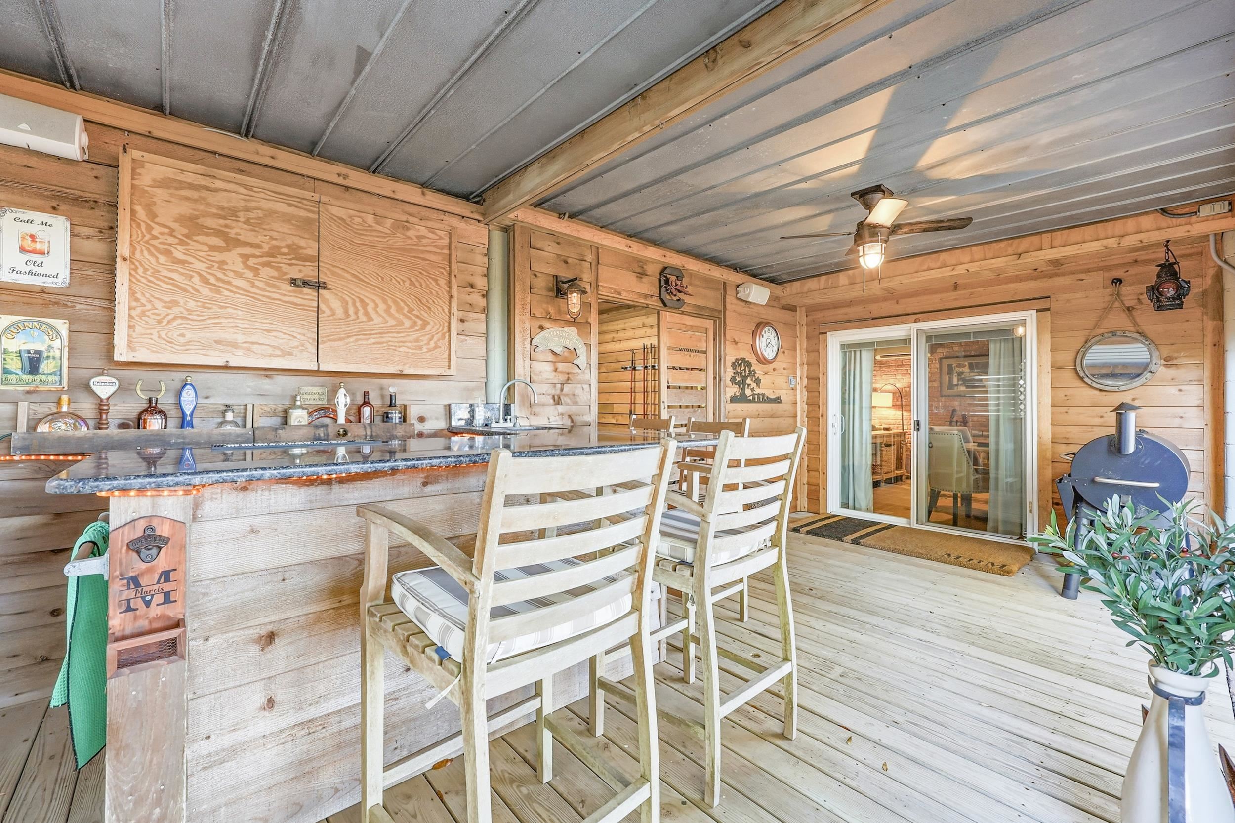 46 High Hammock Way Pawleys Island, SC 29585 - Photo 25 of 40 Wooden deck featuring ceiling fan and an outdoor bar