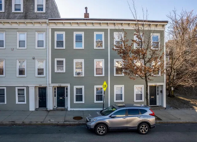 a car parked in front of a building