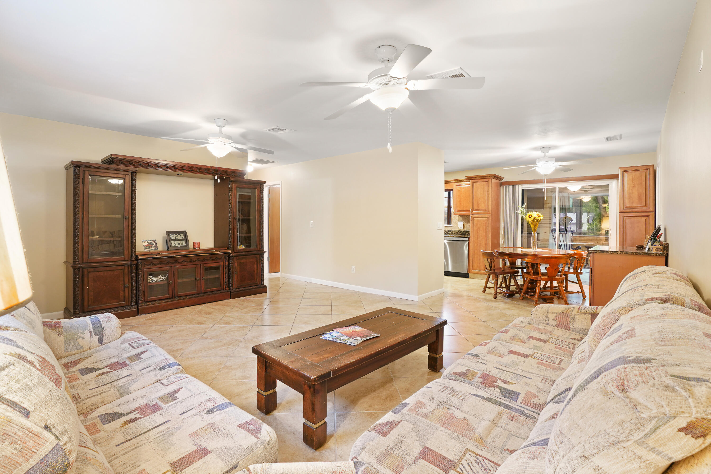 7601 Donlon Road Fort Pierce, FL 34951 - Photo 13 of 32 a living room with furniture and a flat screen tv