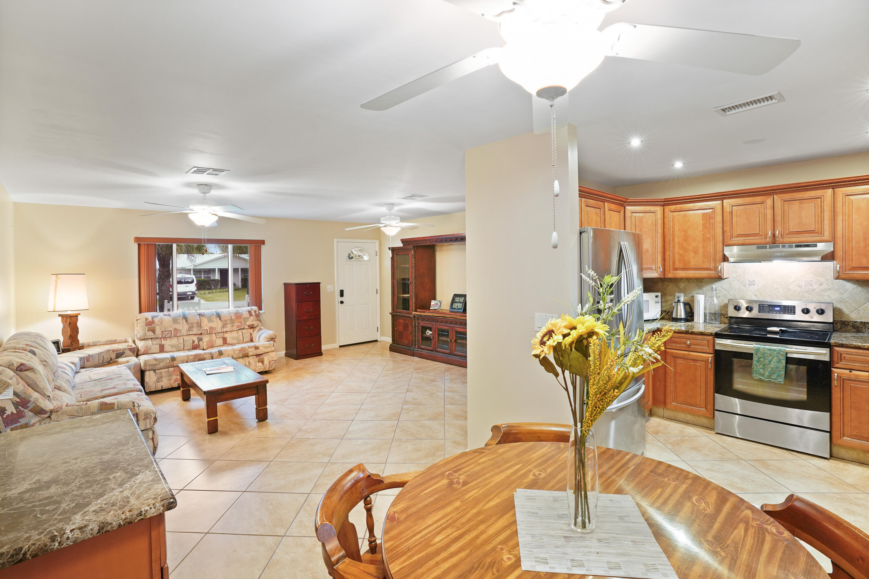 7601 Donlon Road Fort Pierce, FL 34951 - Photo 14 of 32 a living room with furniture and kitchen view