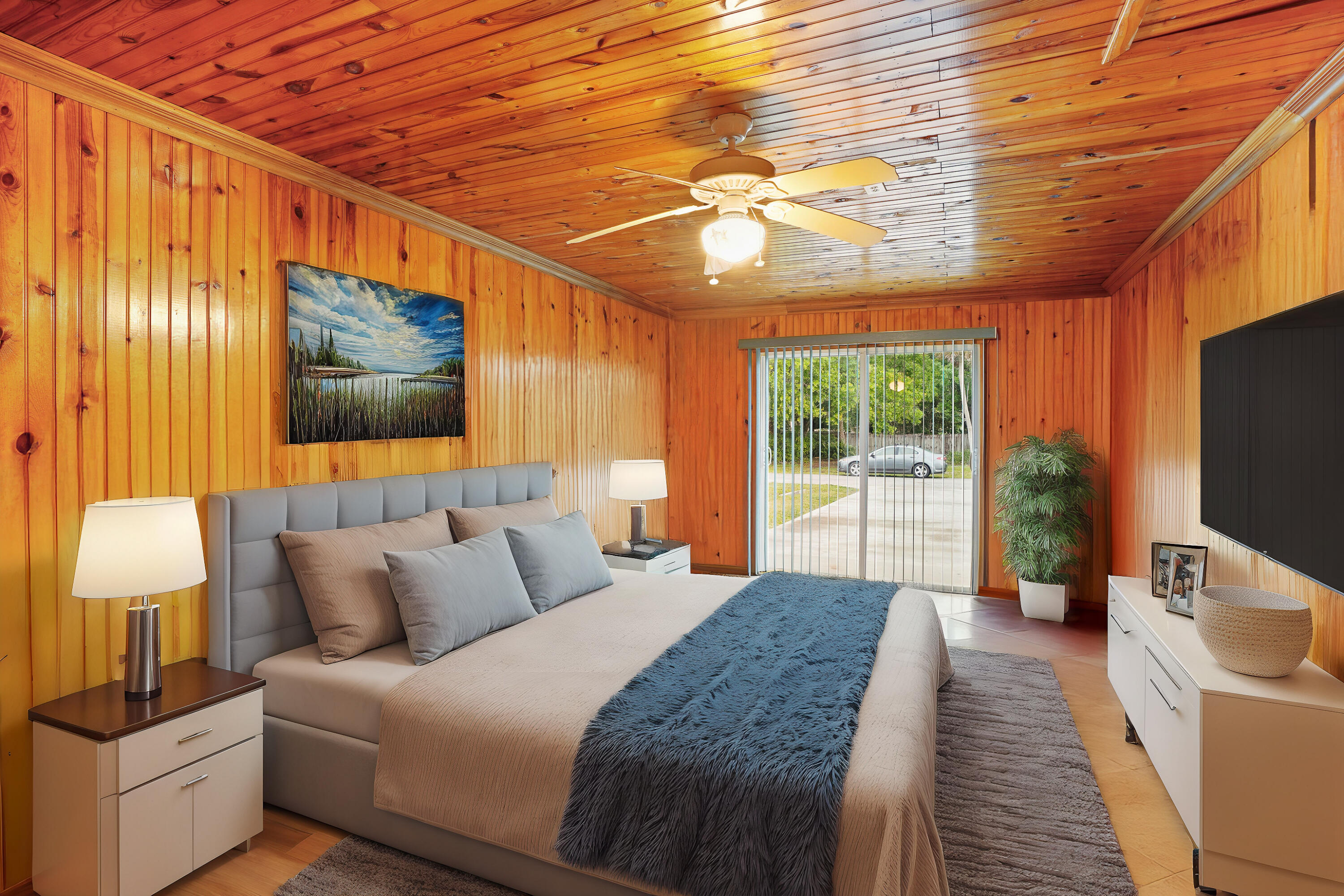 7601 Donlon Road Fort Pierce, FL 34951 - Photo 20 of 32 a bedroom with furniture and a flat screen tv