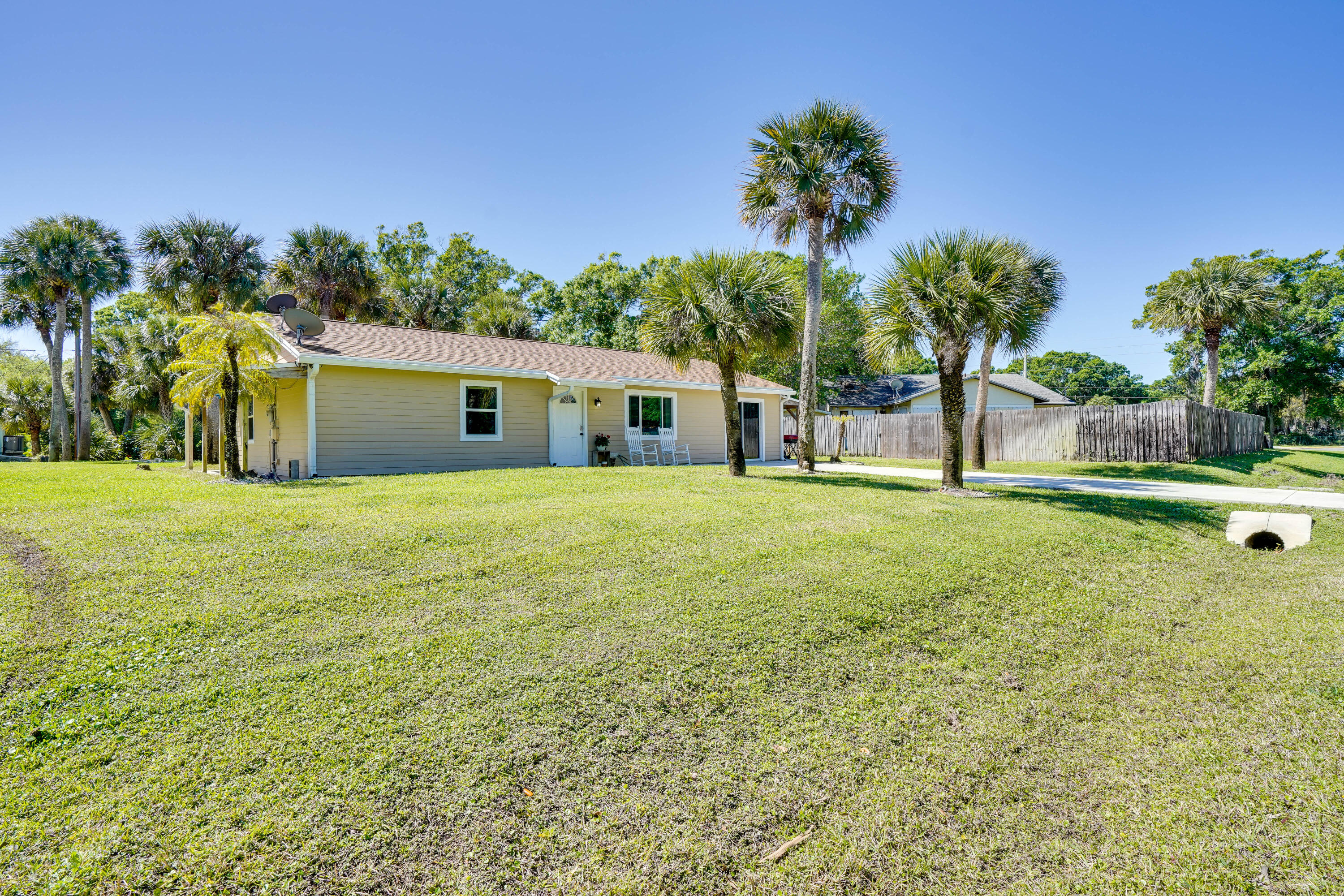 7601 Donlon Road Fort Pierce, FL 34951 - Photo 2 of 32 a view of a house with a yard