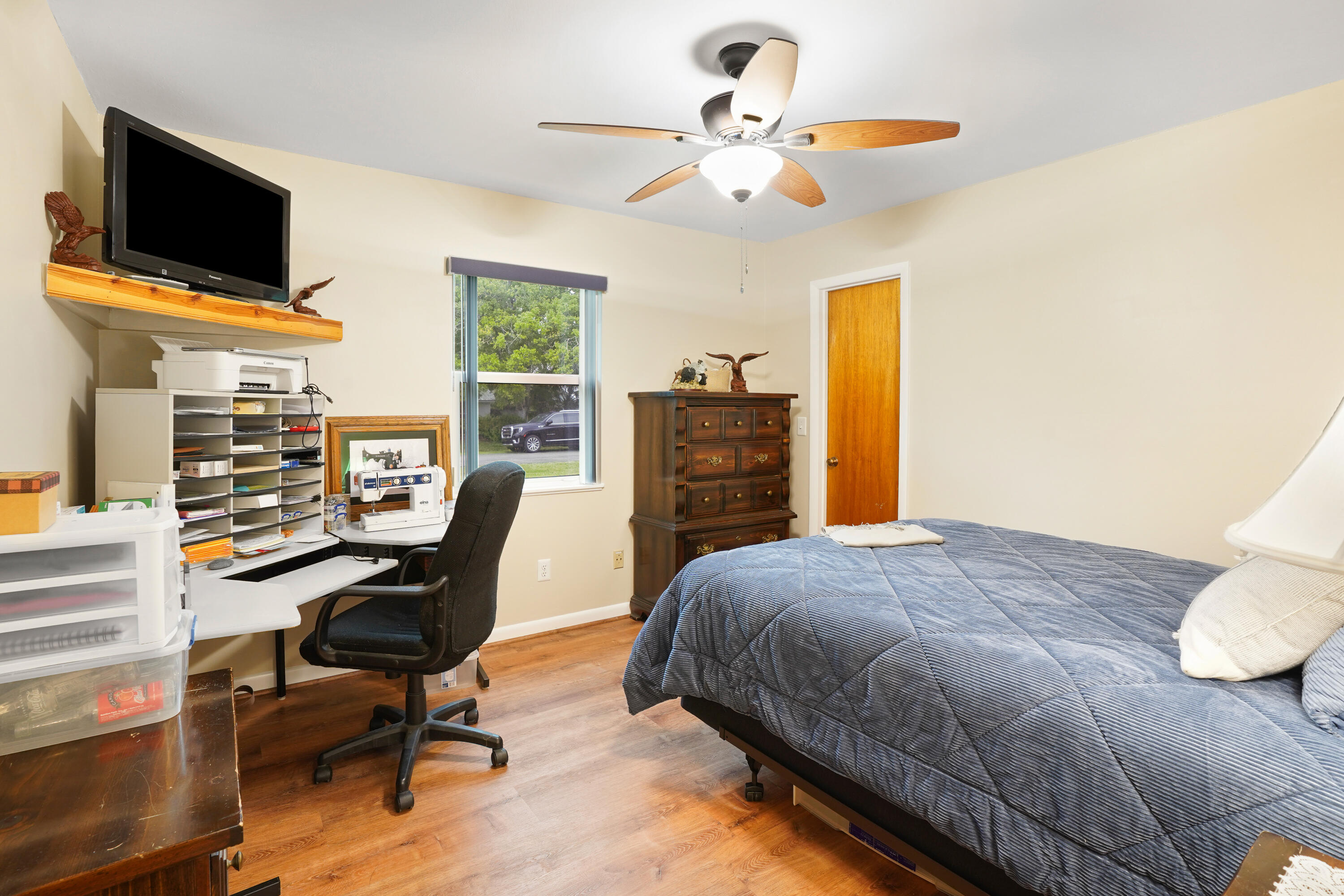 7601 Donlon Road Fort Pierce, FL 34951 - Photo 22 of 32 a bedroom with a bed a computer on a desk and chair
