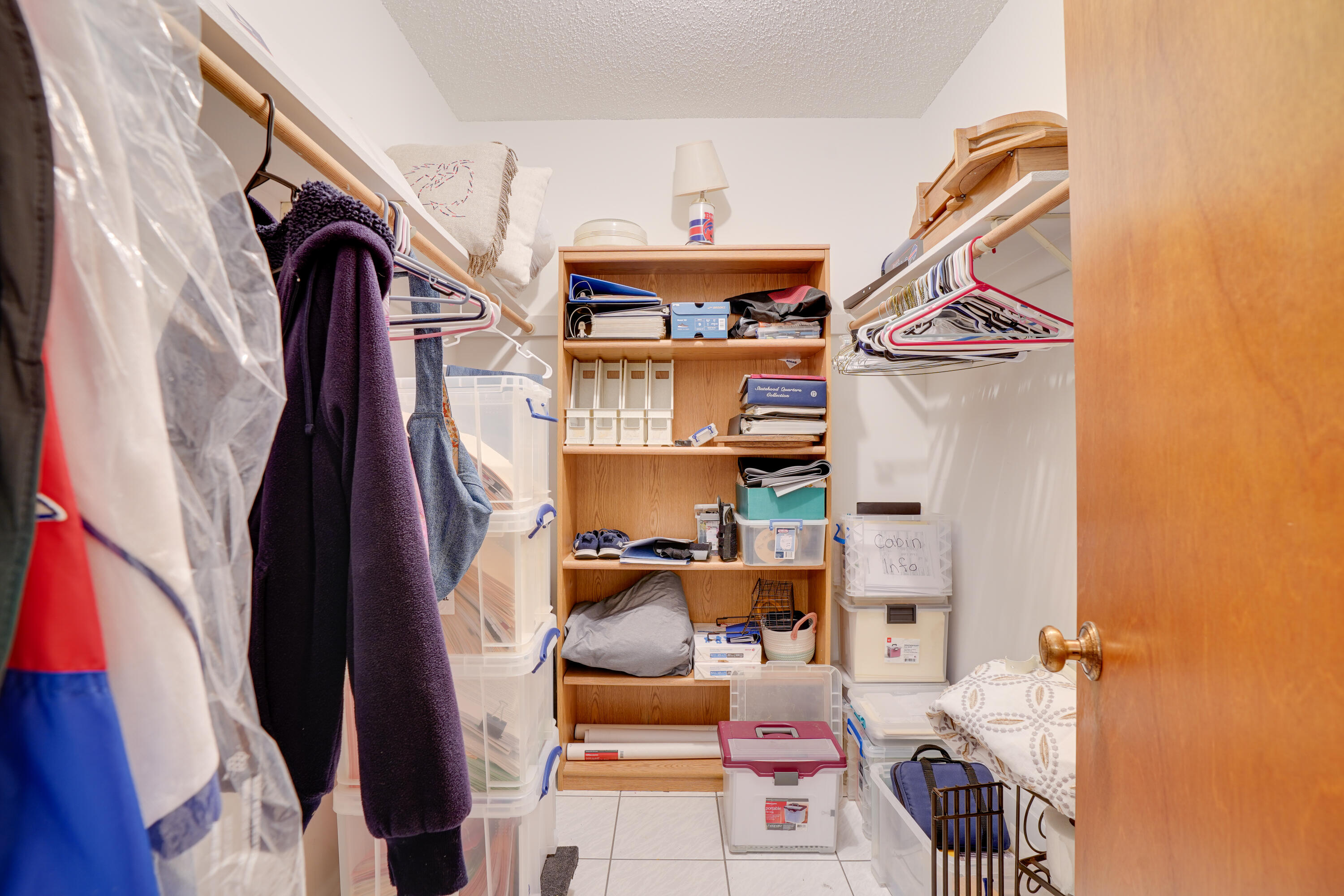 7601 Donlon Road Fort Pierce, FL 34951 - Photo 26 of 32 a view of walk in closet with clothes and shoes